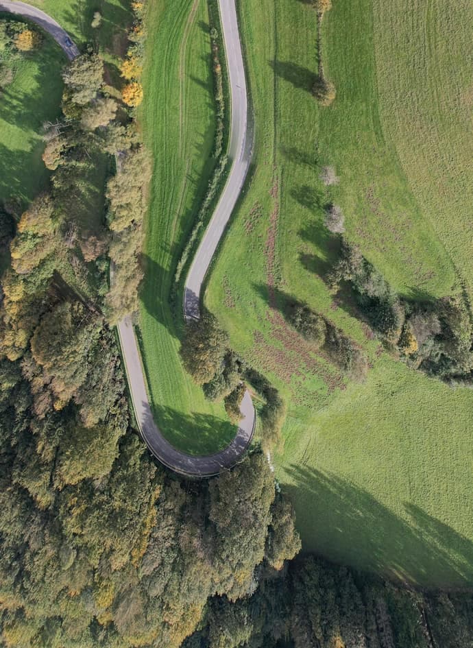 An aerial view of a winding country road.